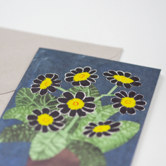 A greeting card featuring striking collage image of a black Auricula, a lovely plant with a sophisticated look.