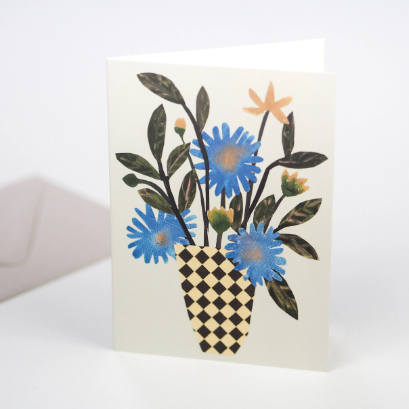 Greeting card featuring a collage of wild flowers in a simple chequer vase on a pale green background.