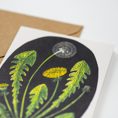 A greeting card featuring an illustration of a dandelion. 