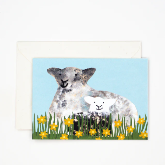 A happy sheep with her lamb having a sit down in some flowers. The perfect new baby, spring or Easter card.