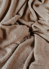 Close up of light brown alpaca wool scarf.