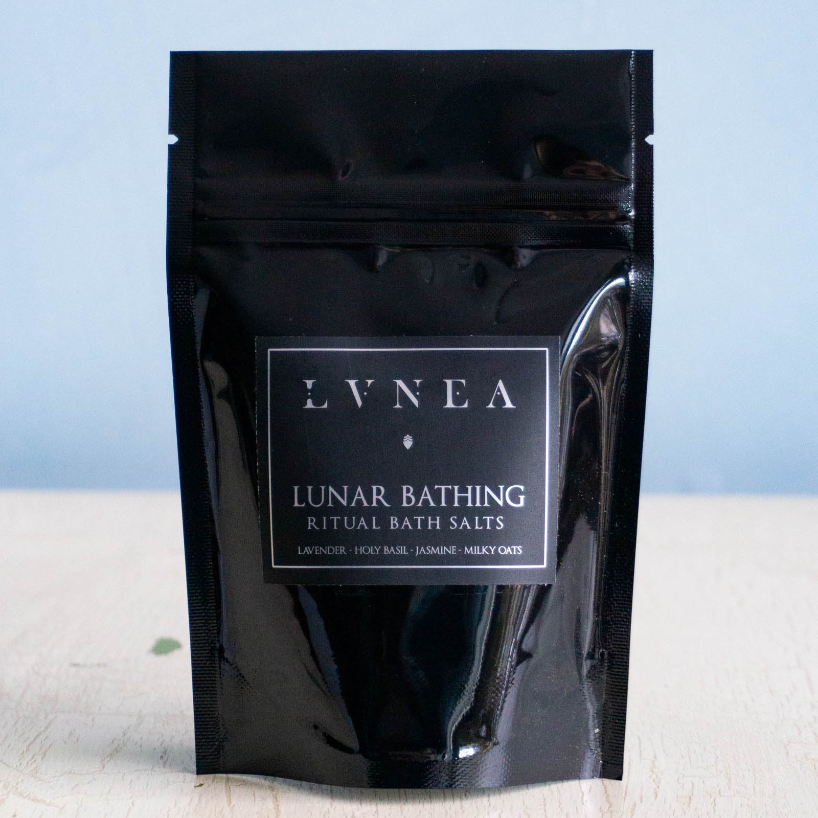 Small black bag filled with  sea salt bath salts.