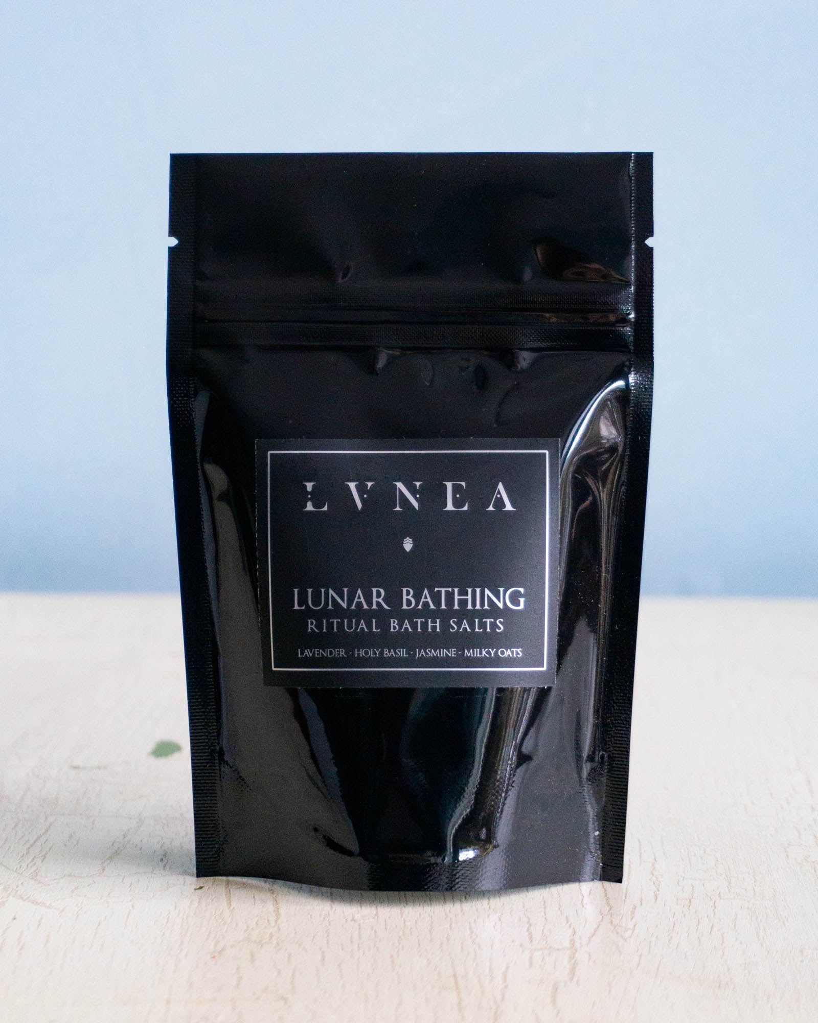 Small black bag filled with  sea salt bath salts.