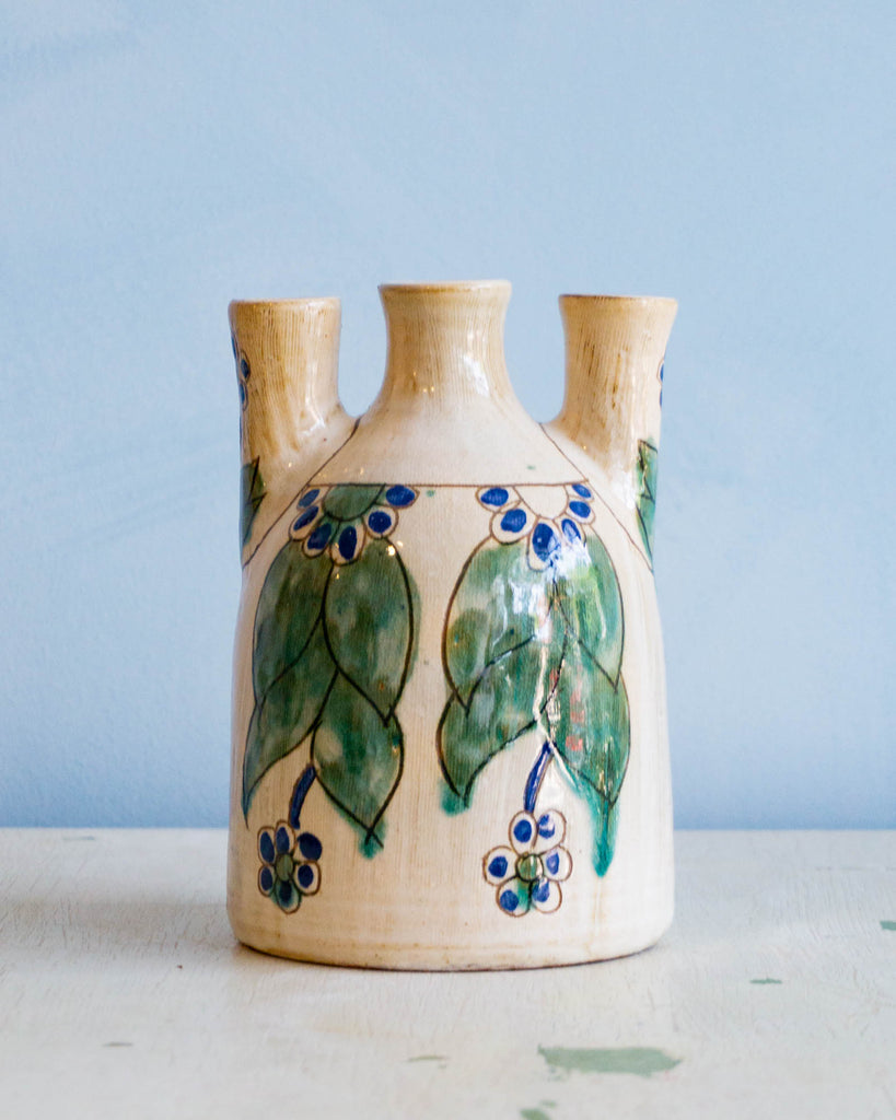 Betero rounded three pronged candle vase.