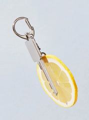 Realistic-looking slice of lemon keychain.