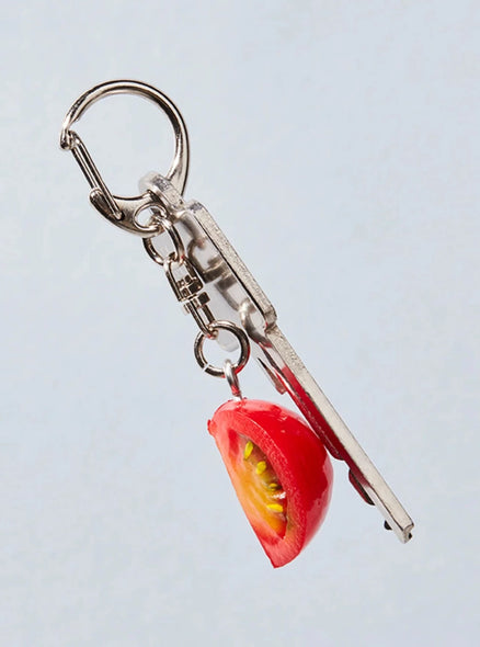 Realistic-looking quartered cherry tomato keychain.