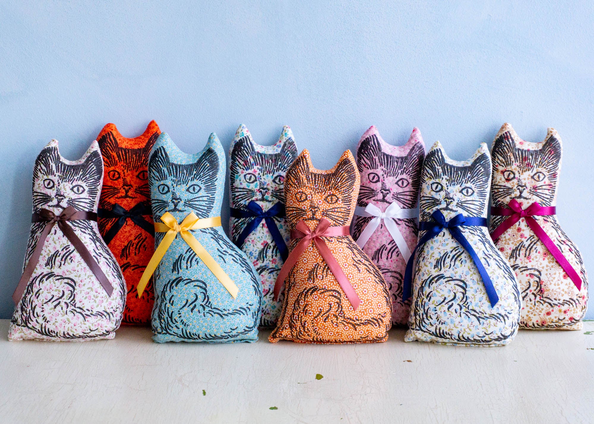 Eight calico cat balsam pillows in assorted colours