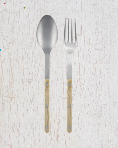 Large serving size spoon and fork, stainless steel with a cream coloured acrylic handle. By Sabre Paris.