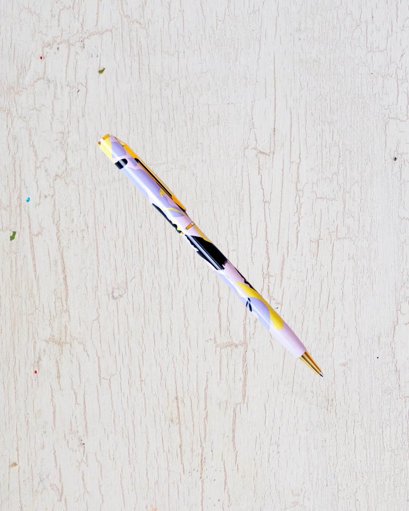 Metal pen with purple and yellow accents