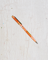 Metal pen with orange accents
